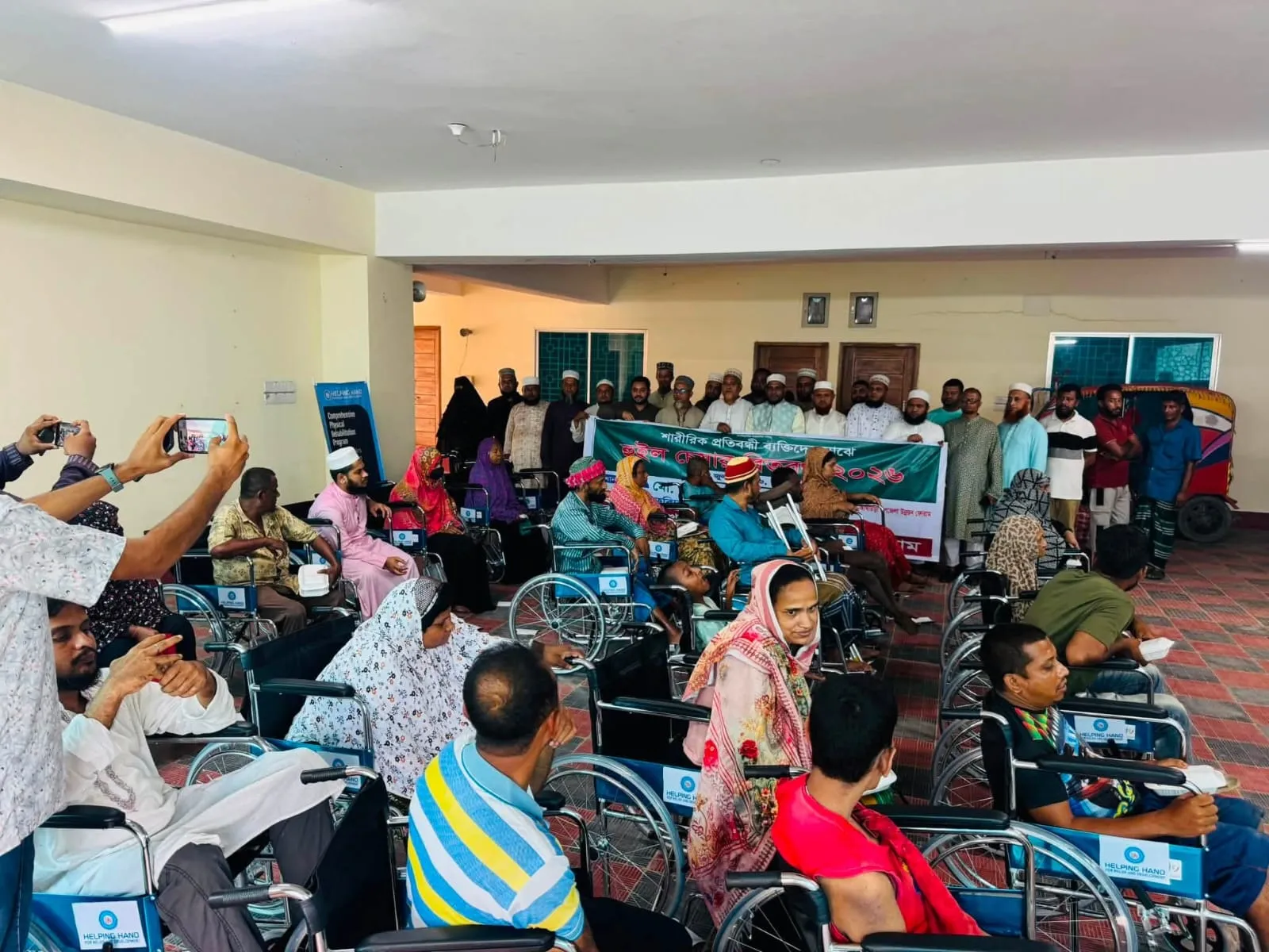 আতাউর রহমান সরকারের উদ্যোগে কসবায় হুইল চেয়ার বিতরণ